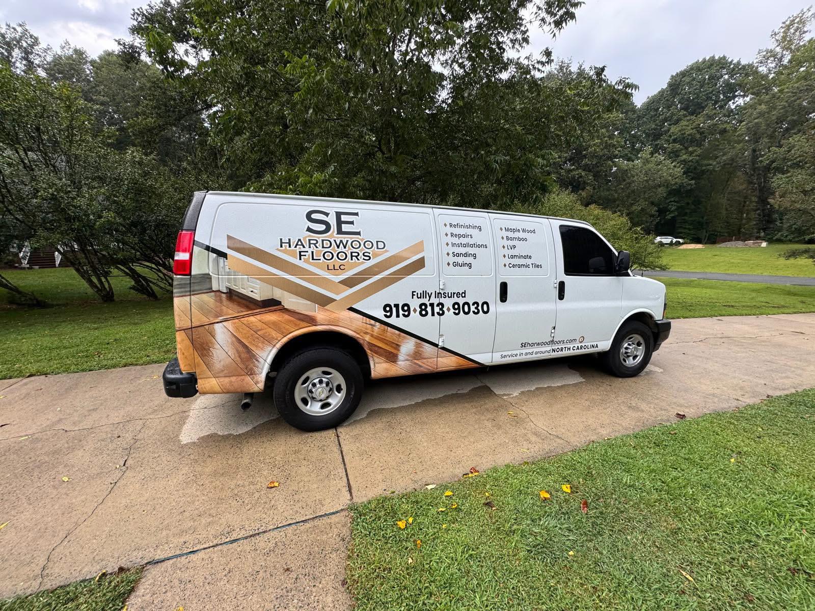 SE Hardwood Floors service van parked in a driveway