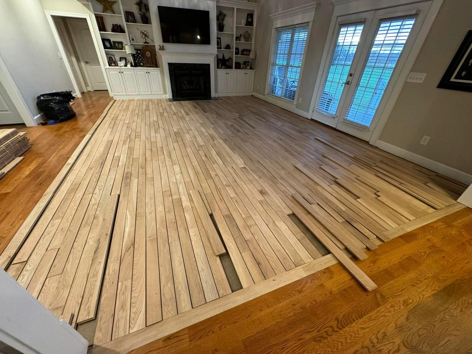 New unfinished oak floor installation in a living room